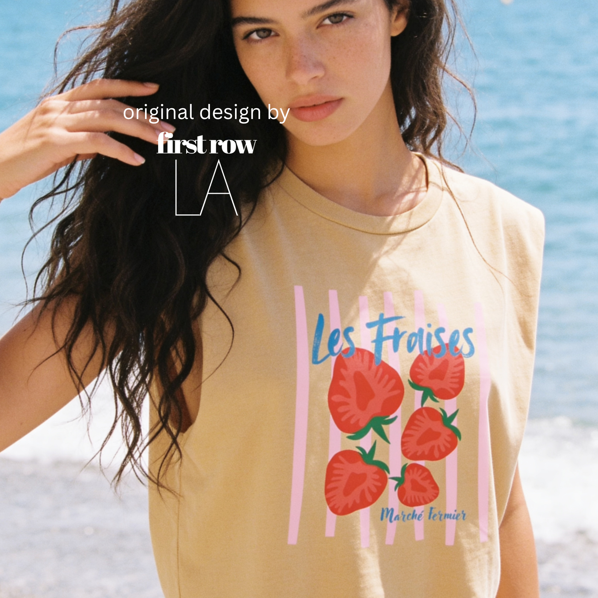 A woman wearing a sleeveless t-shirt with a pink striped pattern and red strawberries printed on the front.

Original design and copyright by first row LA.