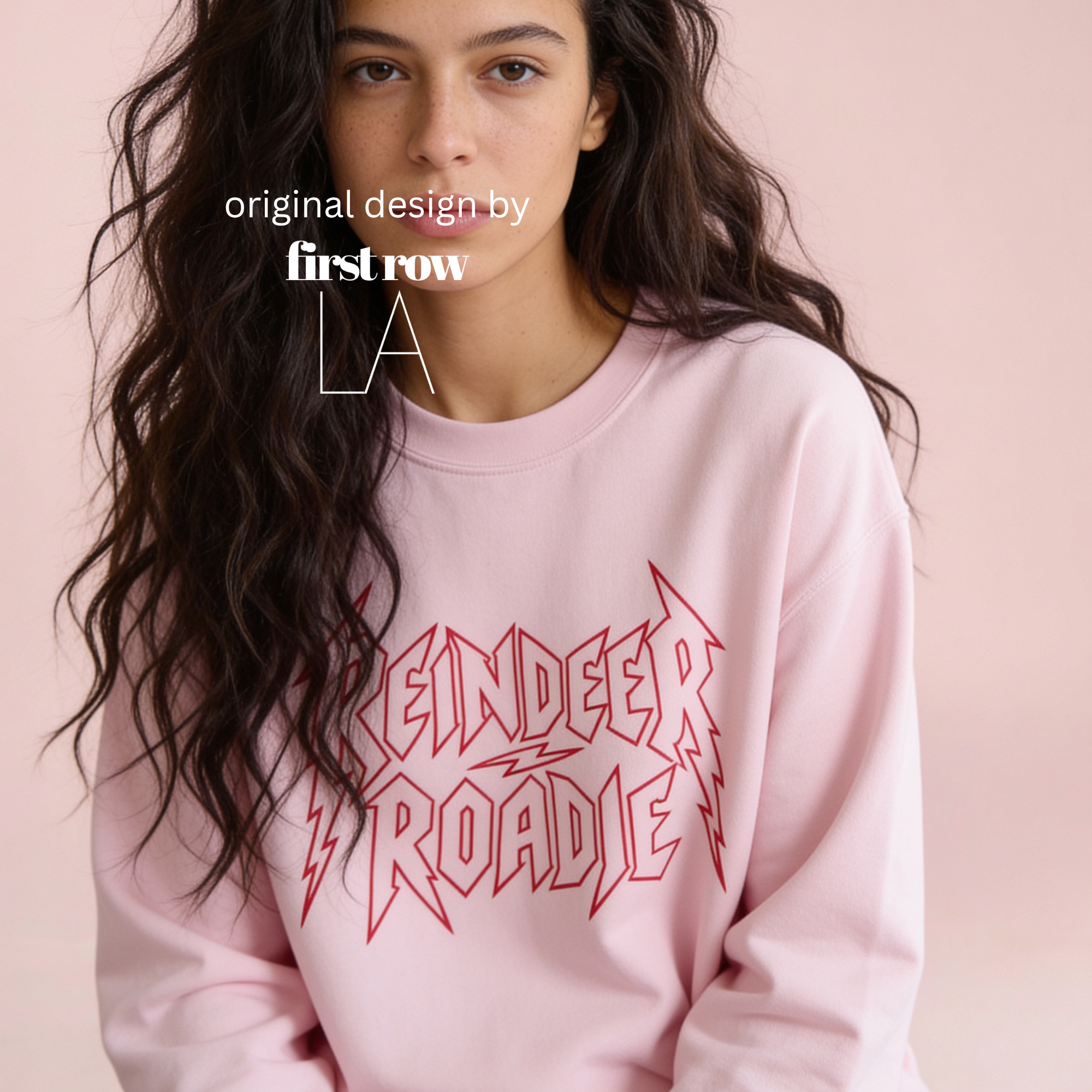 A woman wearing 'Reindeer Roadie' unisex Christmas sweatshirt.

Original design and copyright by first row LA.
