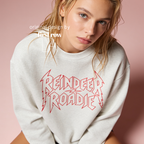 A woman wearing 'Reindeer Roadie' unisex Christmas sweatshirt.

Original design and copyright by first row LA.
