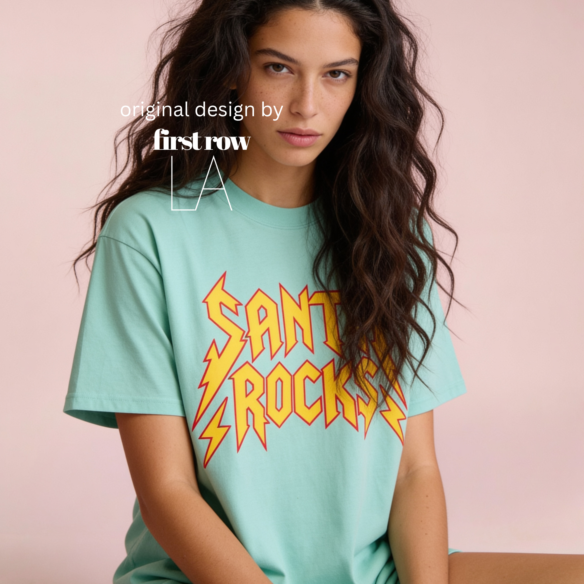 A woman wearing 'SANTA ROCKS' unisex funny Christmas T-shirt.

Original design and copyright by first row LA.