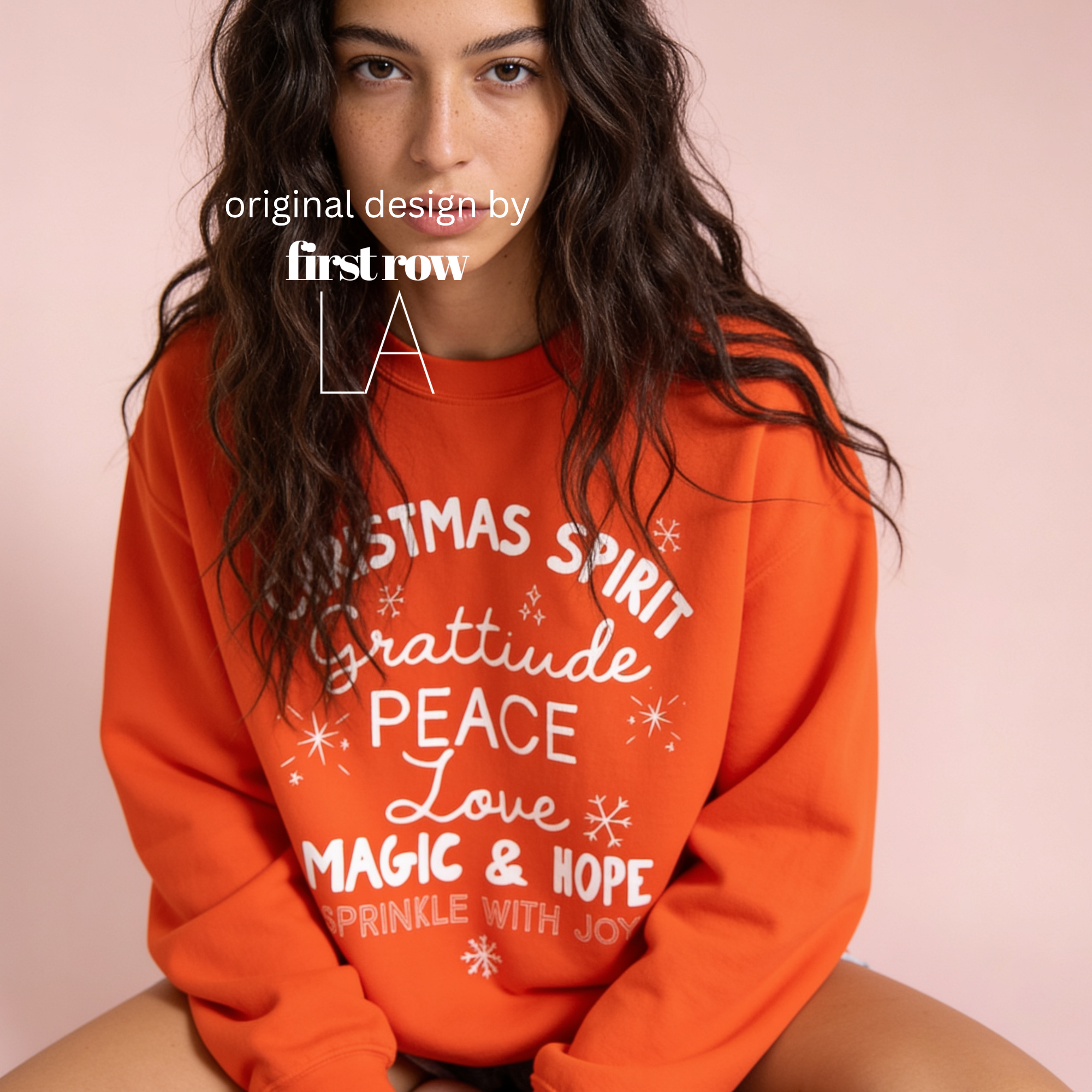 A woman wearing 'CHRISTMAS SPIRIT Gratitude PEACE Love MAGIC & HOPE Sprinkle with Joy' unisex sweatshirt.

Original design and copyright by first row LA August 10th, 2026.