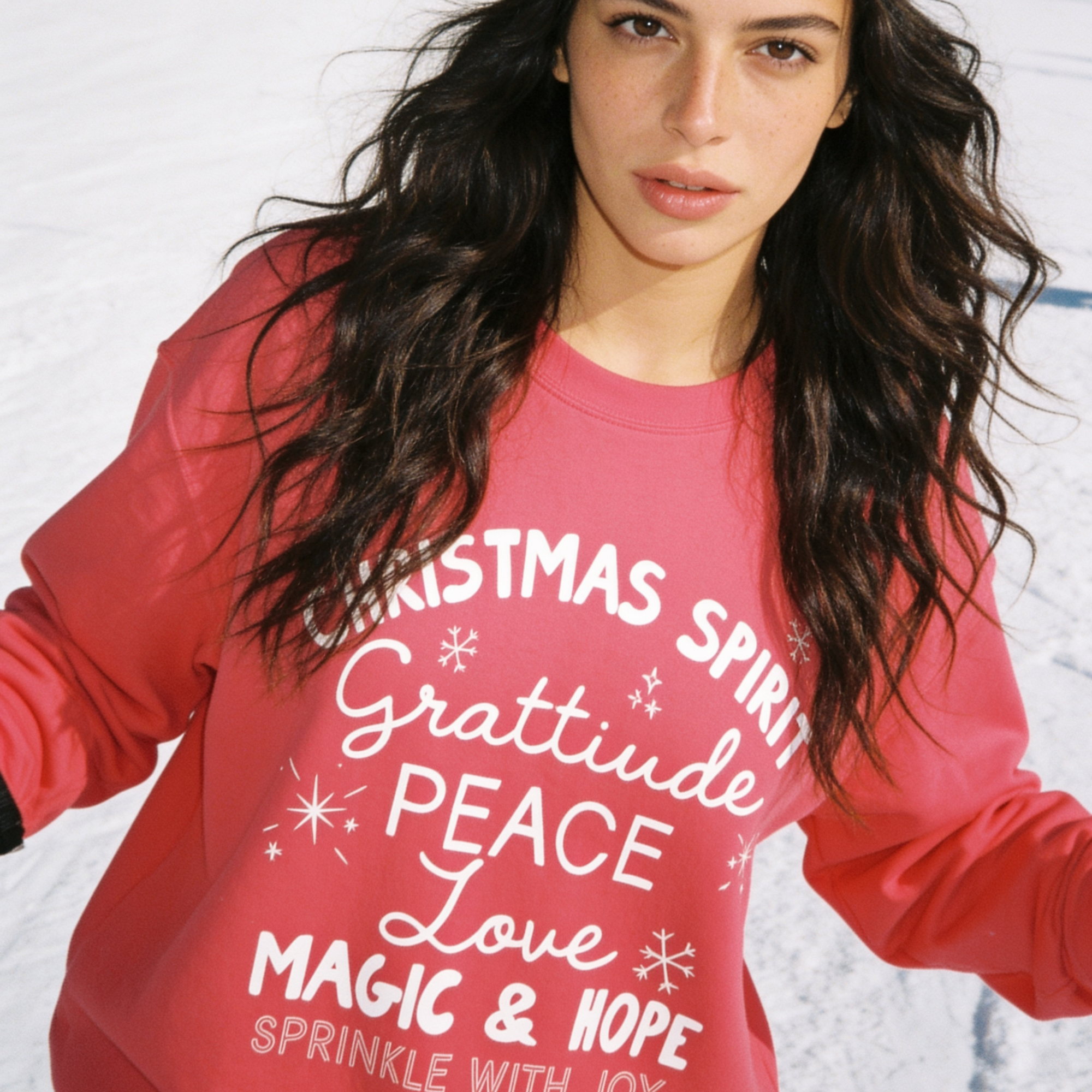 A woman wearing 'CHRISTMAS SPIRIT Gratitude PEACE Love MAGIC & HOPE Sprinkle with Joy' unisex sweatshirt.

Original design and copyright by first row LA August 10th, 2026.