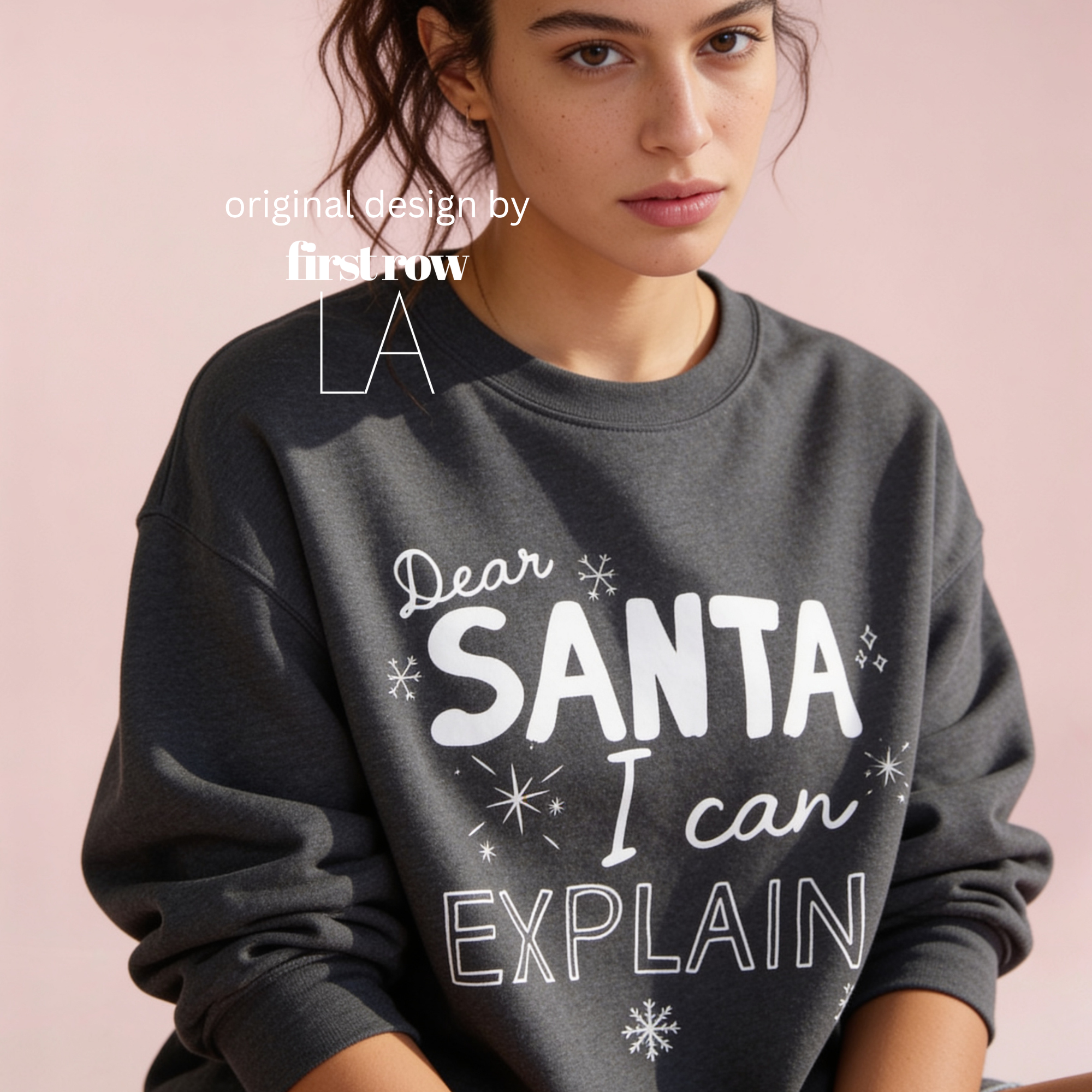 A woman wearing crewneck sweatshirt with the text 'Dear SANTA I can EXPLAIN'.

Original design and copyright by first row LA, August 10th 2026.