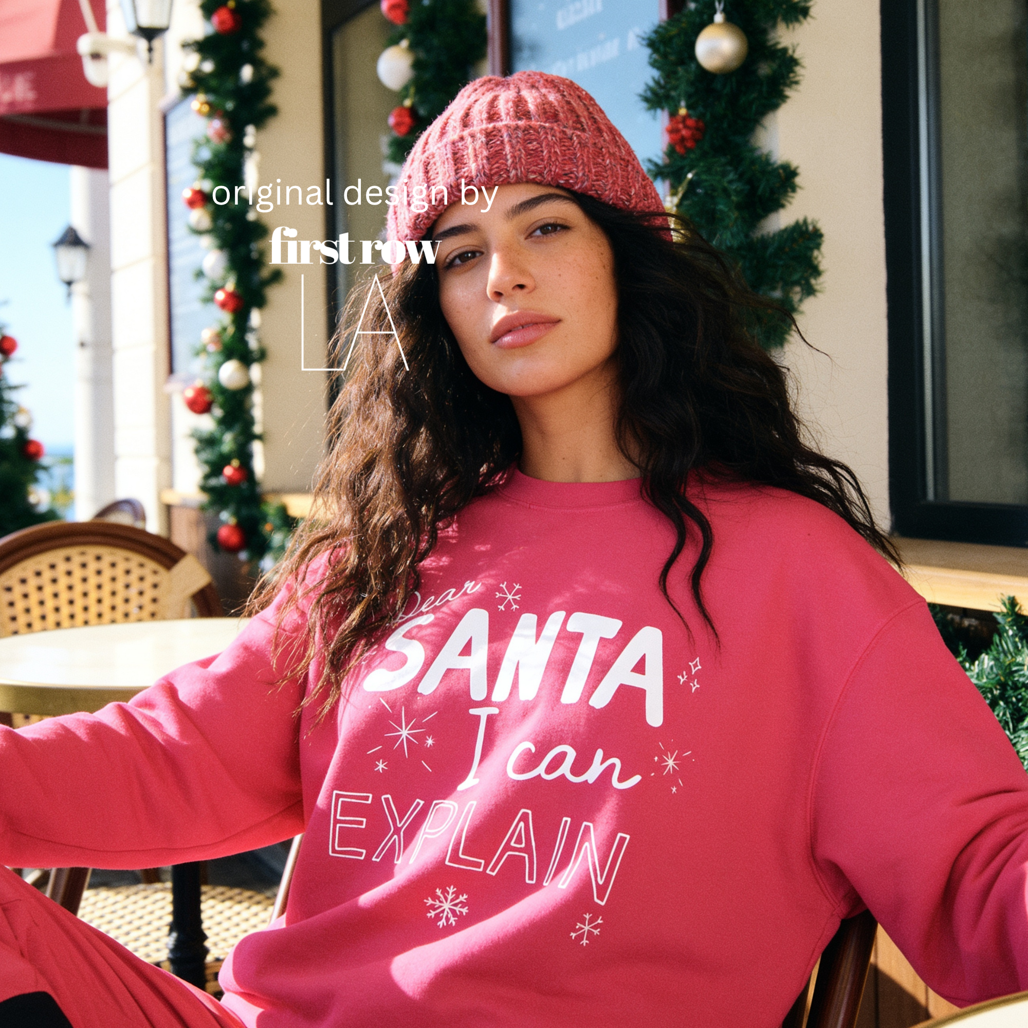 A woman wearing crewneck sweatshirt with the text 'Dear SANTA I can EXPLAIN'.

Original design and copyright by first row LA, August 10th 2026.
