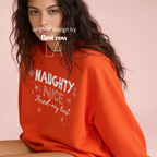 A woman wearing a crewneck sweatshirt with the text 'NAUGHTY, NICE - Tried my best'.

Original design and copyright by first row LA, August 11th 2026.