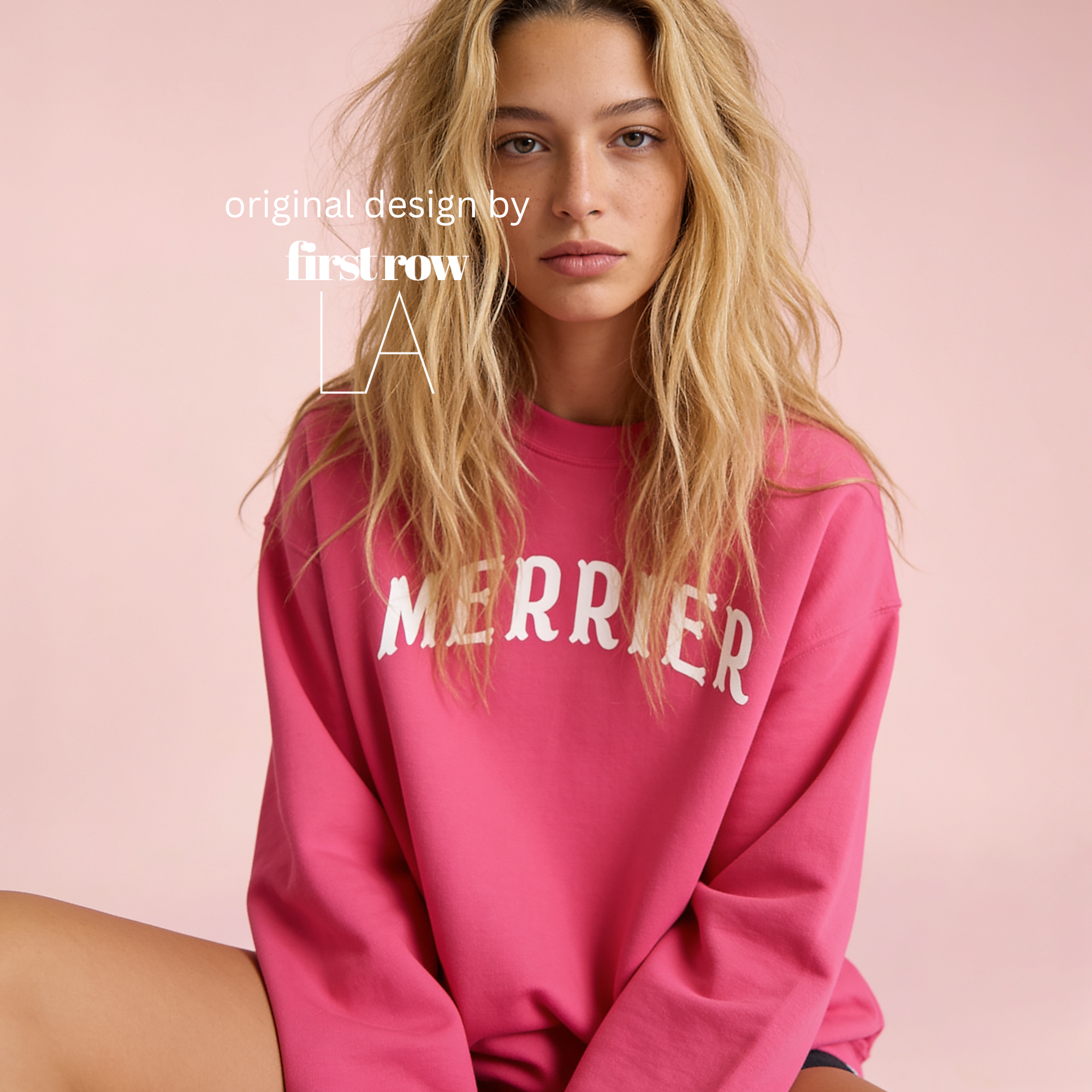A woman wearing a bright pink crewneck sweatshirt with 'MERRIER' printed in white arched letters across the chest.

Original design and copyright by first row LA, August 11th 2026.