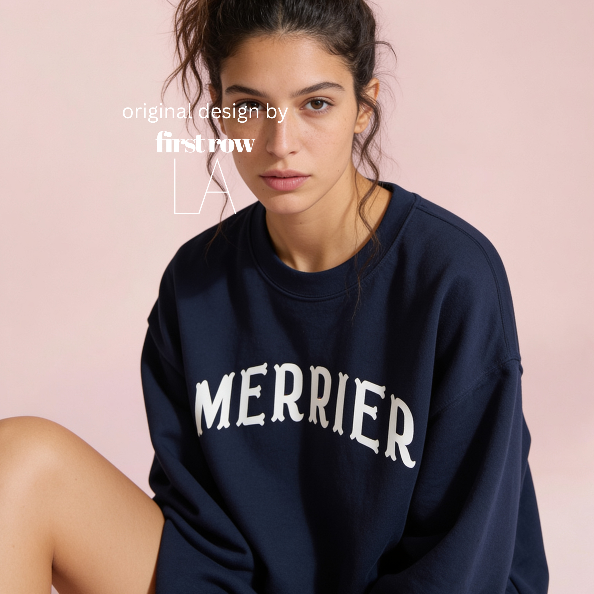 A woman wearing a bright pink crewneck sweatshirt with 'MERRIER' printed in white arched letters across the chest.

Original design and copyright by first row LA, August 11th 2026.