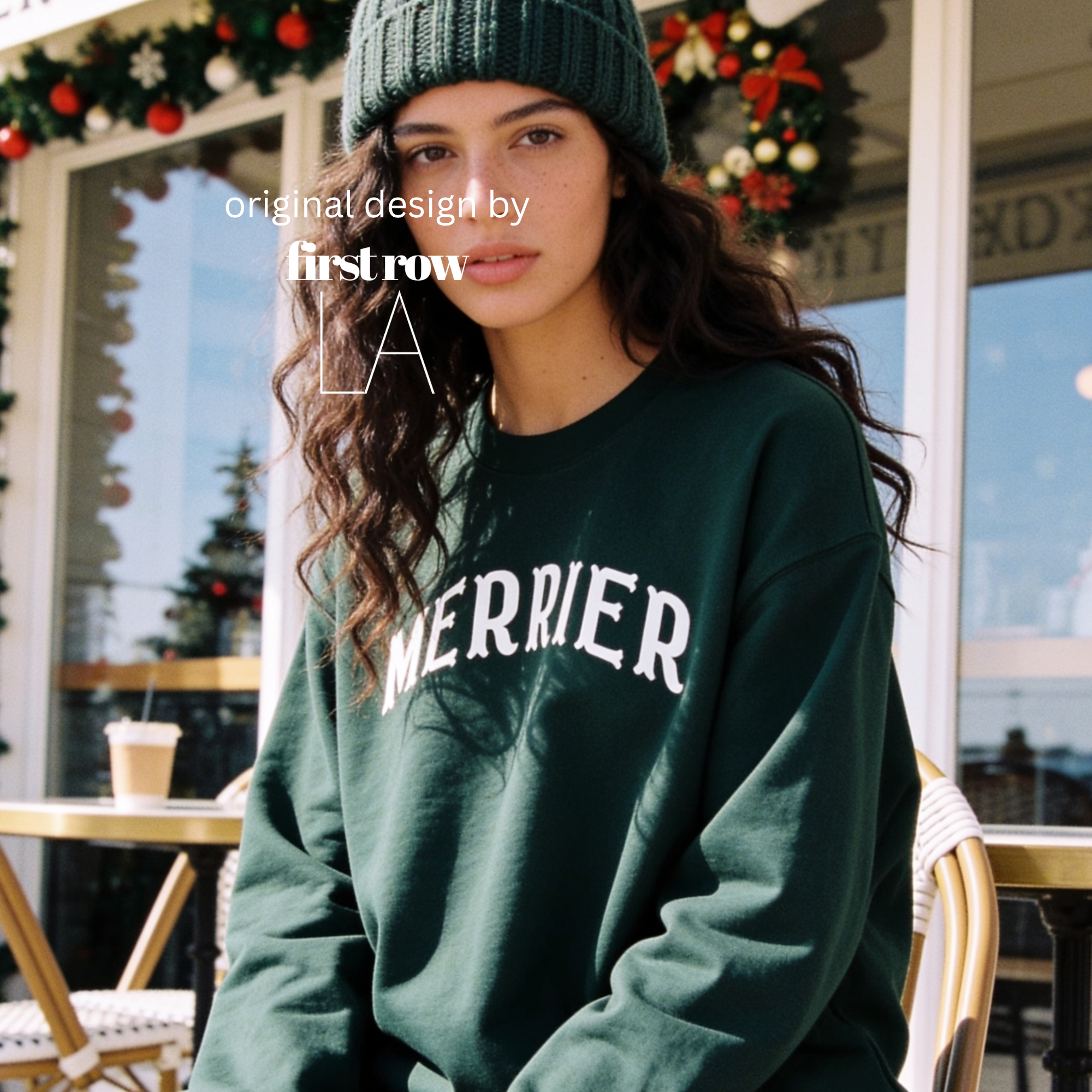 A woman wearing a bright pink crewneck sweatshirt with 'MERRIER' printed in white arched letters across the chest.

Original design and copyright by first row LA, August 11th 2026.