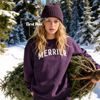 A woman wearing a bright pink crewneck sweatshirt with 'MERRIER' printed in white arched letters across the chest.

Original design and copyright by first row LA, August 11th 2026.