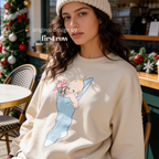 A woman wearing a Christmas sweatshirt with a Kewpie cartoon baby graphic.

Original design and copyright by first row LA, august 12th 2026.