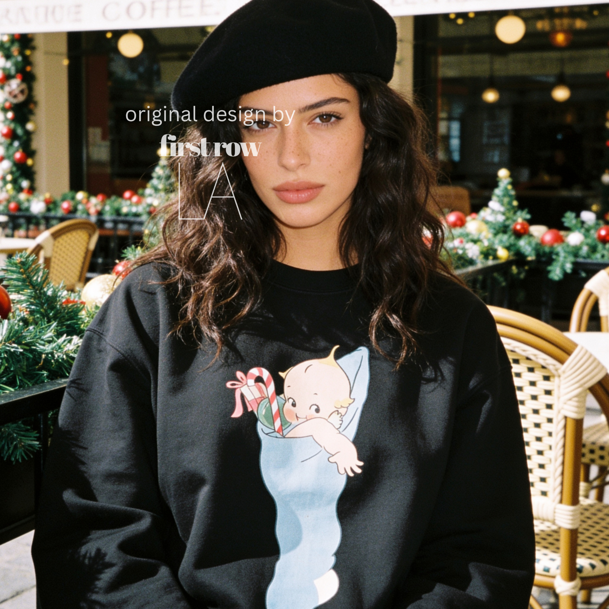 A woman wearing a Christmas sweatshirt with a Kewpie cartoon baby graphic.

Original design and copyright by first row LA, august 12th 2026.