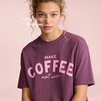 Woman wearing Make Coffee Not War T-Shirt, Pink Lettering Coffee Tee, Peace Shirt, Coffee Lover Graphic Tee, Anti War Statement Shirt.

Original design and copyright by first row LA 2026.