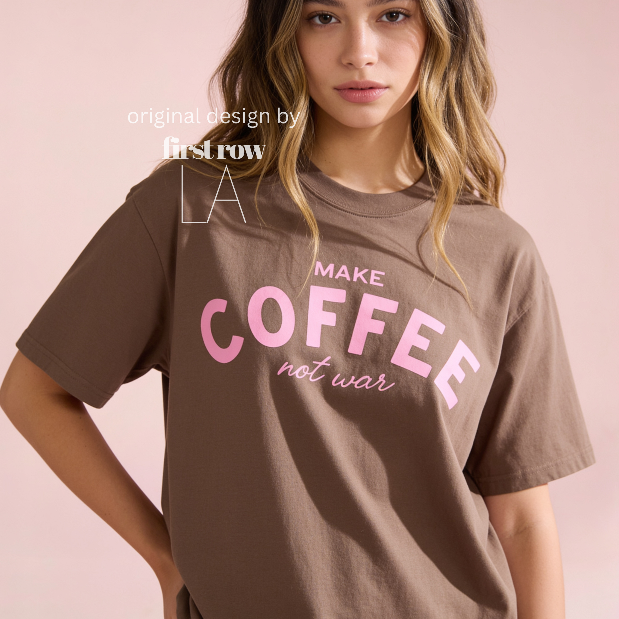Woman wearing Make Coffee Not War T-Shirt, Pink Lettering Coffee Tee, Peace Shirt, Coffee Lover Graphic Tee, Anti War Statement Shirt.

Original design and copyright by first row LA 2026.