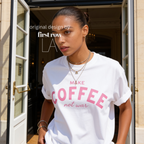 Woman wearing Make Coffee Not War T-Shirt, Pink Lettering Coffee Tee, Peace Shirt, Coffee Lover Graphic Tee, Anti War Statement Shirt.

Original design and copyright by first row LA 2026.