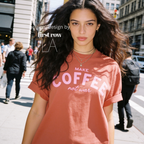 Woman wearing Make Coffee Not War T-Shirt, Pink Lettering Coffee Tee, Peace Shirt, Coffee Lover Graphic Tee, Anti War Statement Shirt.

Original design and copyright by first row LA 2026.