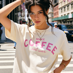 Woman wearing Make Coffee Not War T-Shirt, Pink Lettering Coffee Tee, Peace Shirt, Coffee Lover Graphic Tee, Anti War Statement Shirt.

Original design and copyright by first row LA 2026.