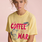 Woman wearing Make Coffee Not War TShirt, Peace Coffee Tee, Moka Pot Graphic Tee, Coffee Lover Shirt, Anti War Tee, Espresso T, Barista, Cute Coffee Shirt.

Original design and copyright by first row LA 2026.
