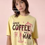 Woman wearing Make Coffee Not War T-Shirt, Peace Coffee Shirt, Moka Pot & Tulip Graphic Tee, Coffee Lover Shirt, Anti War Tee, Floral Shirt, Coffee Gift.

Original design and copyright by first row LA 2026.