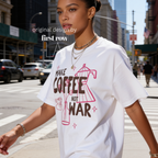 Woman wearing Make Coffee Not War T-Shirt, Peace Coffee Shirt, Moka Pot & Tulip Graphic Tee, Coffee Lover Shirt, Anti War Tee, Floral Shirt, Coffee Gift.

Original design and copyright by first row LA 2026.