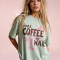 Woman wearing Make Coffee Not War T-Shirt, Peace Coffee Shirt, Moka Pot & Tulip Graphic Tee, Coffee Lover Shirt, Anti War Tee, Floral Shirt, Coffee Gift.

Original design and copyright by first row LA 2026.