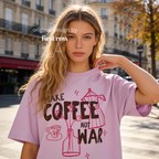 Woman wearing Make Coffee Not War T-Shirt, Peace Coffee Shirt, Moka Pot & Tulip Graphic Tee, Coffee Lover Shirt, Anti War Tee, Floral Shirt, Coffee Gift.

Original design and copyright by first row LA 2026.