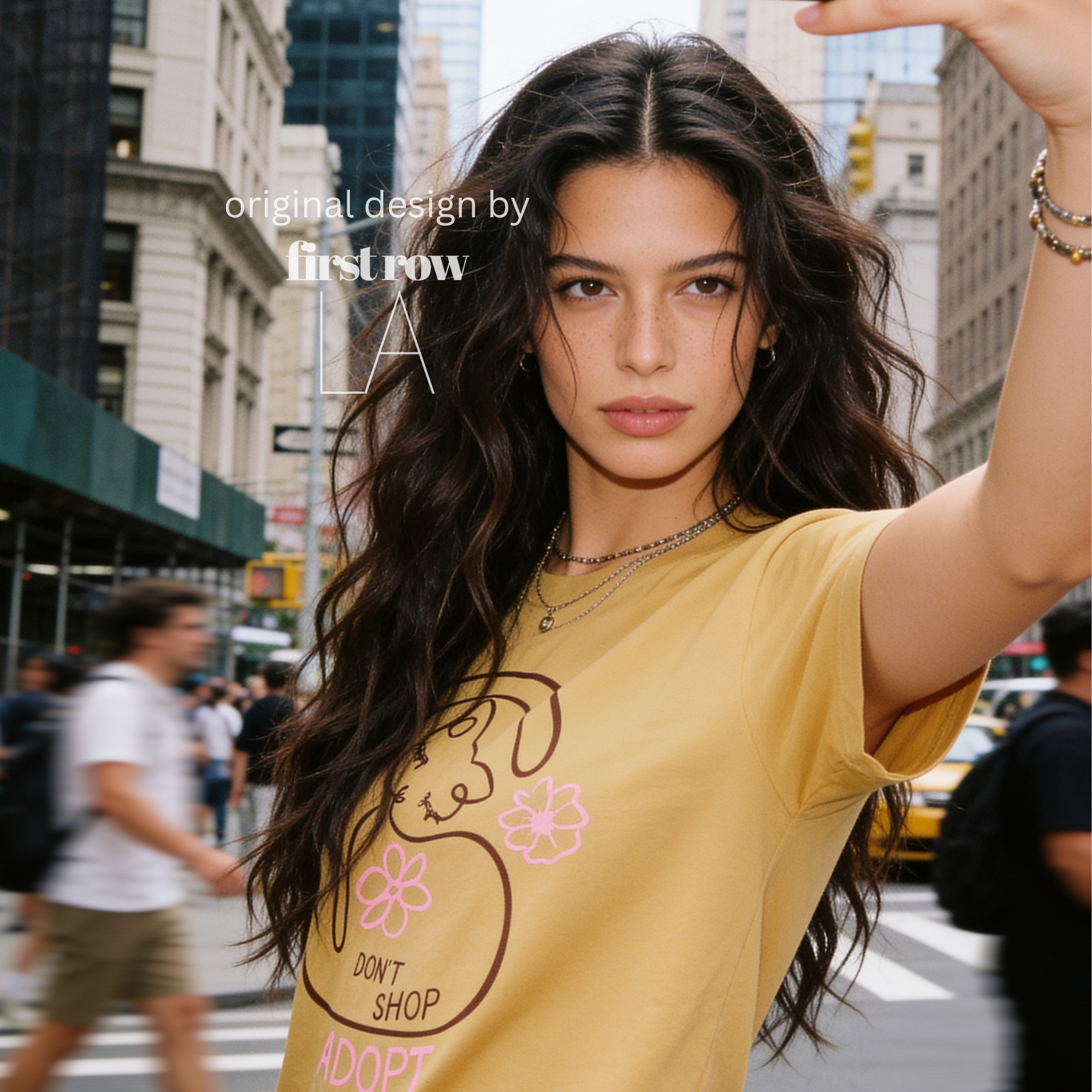 A woman wearing a graphic T-shirt with a cat illustration and the words 'DON'T SHOP ADOPT'.

Original design and copyright by first row LA 2021.