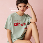 A woman wearing graphic t-shirt with the words 'PICK KINDNESS' and a strawberry illustration.

Original designs and copyright by first row LA 2025.