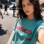 A woman wearing graphic t-shirt with the words 'PICK KINDNESS' and a strawberry illustration.

Original designs and copyright by first row LA 2025.