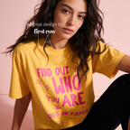 A woman wearing aT-shirt with bright pink text that reads 'FIND OUT WHO YOU ARE & DO IT ON PURPOSE'.

Original design and copyright by first row LA August 26th, 2026