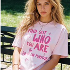 A woman wearing aT-shirt with bright pink text that reads 'FIND OUT WHO YOU ARE & DO IT ON PURPOSE'.

Original design and copyright by first row LA August 26th, 2026