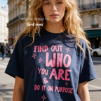 A woman wearing aT-shirt with bright pink text that reads 'FIND OUT WHO YOU ARE & DO IT ON PURPOSE'.

Original design and copyright by first row LA August 26th, 2026