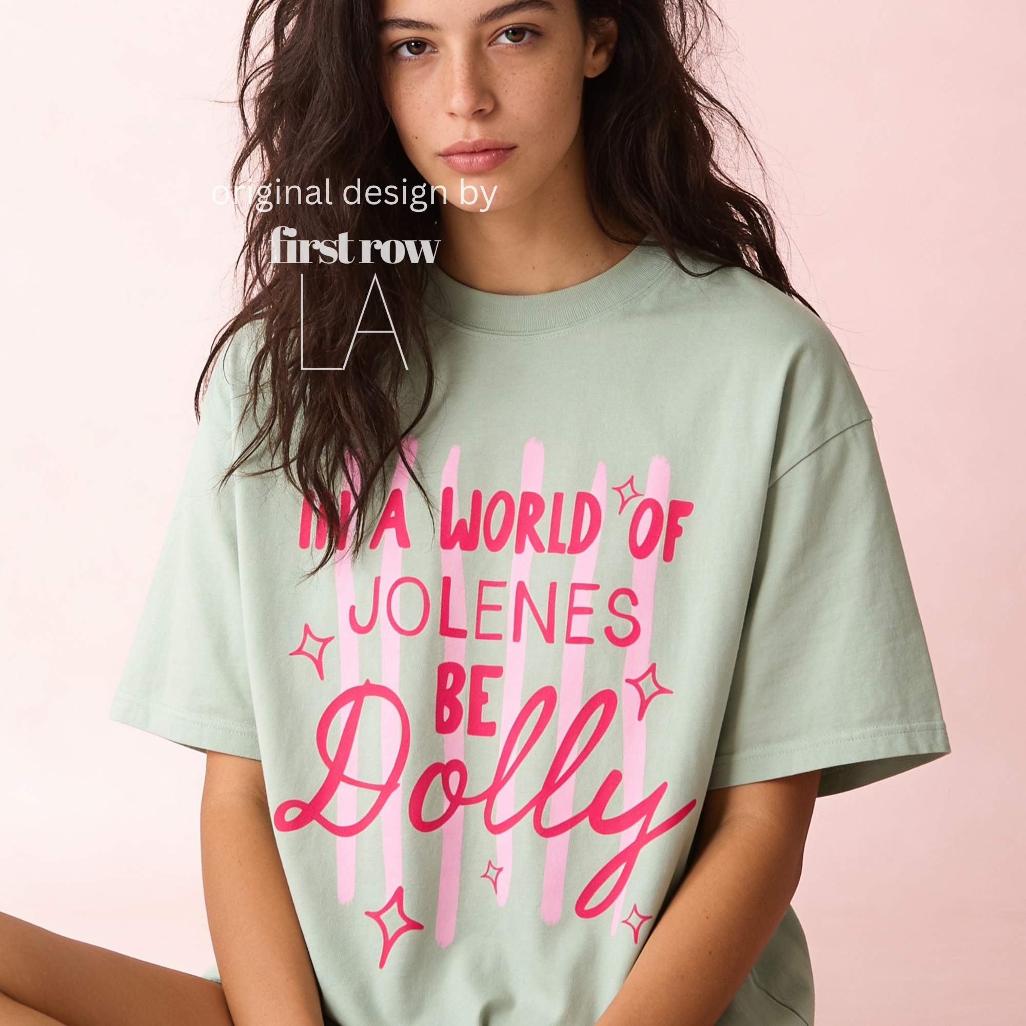 A woman wearing In a World of Jolenes Be Dolly T-shirt.

Original design and copyright by first row LA August 28th, 2026.