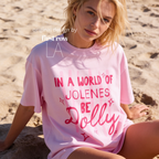 A woman wearing In a World of Jolenes Be Dolly T-shirt.

Original design and copyright by first row LA August 28th, 2026.