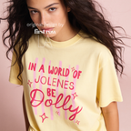 A woman wearing In a World of Jolenes Be Dolly T-shirt.

Original design and copyright by first row LA August 28th, 2026.