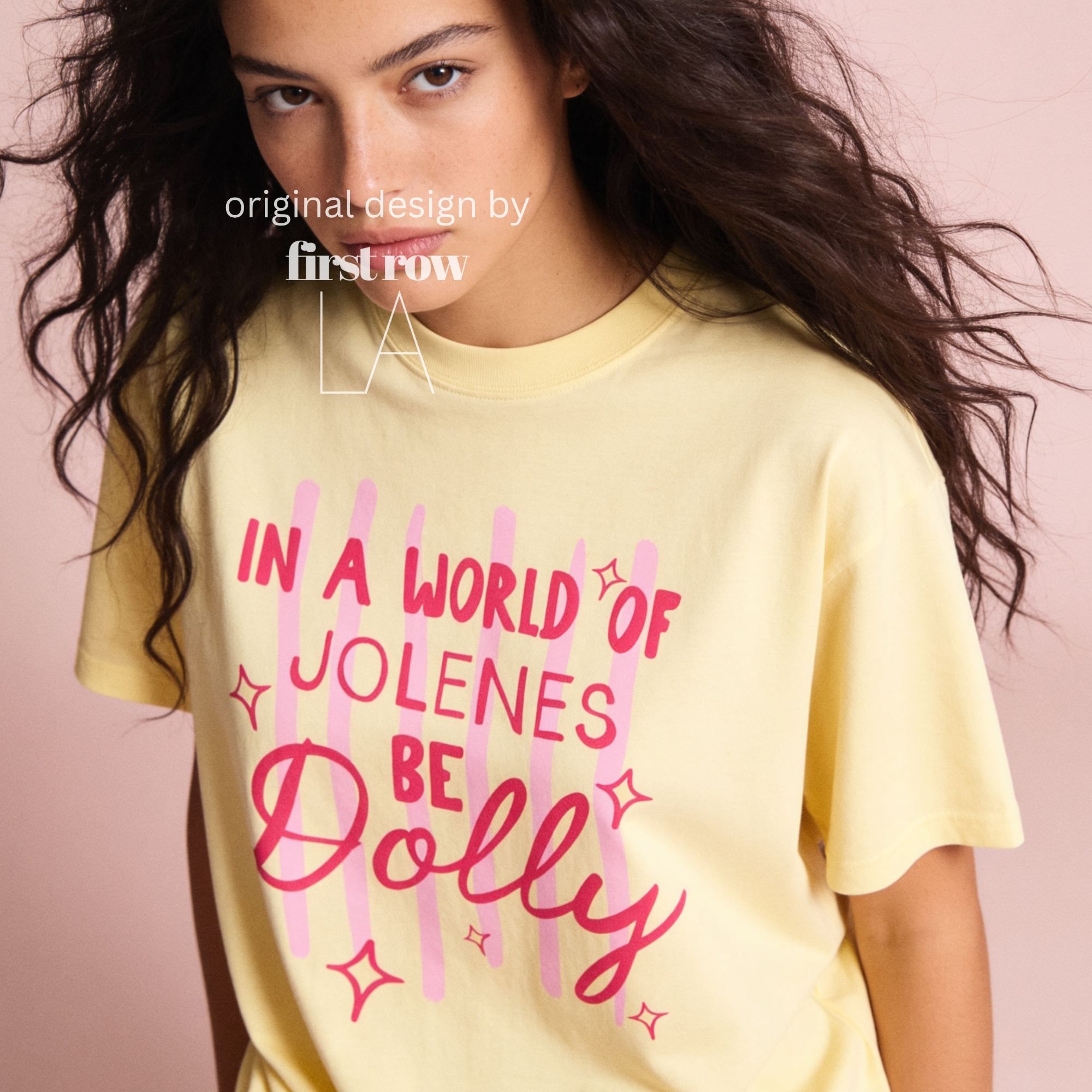 A woman wearing In a World of Jolenes Be Dolly T-shirt.

Original design and copyright by first row LA August 28th, 2026.