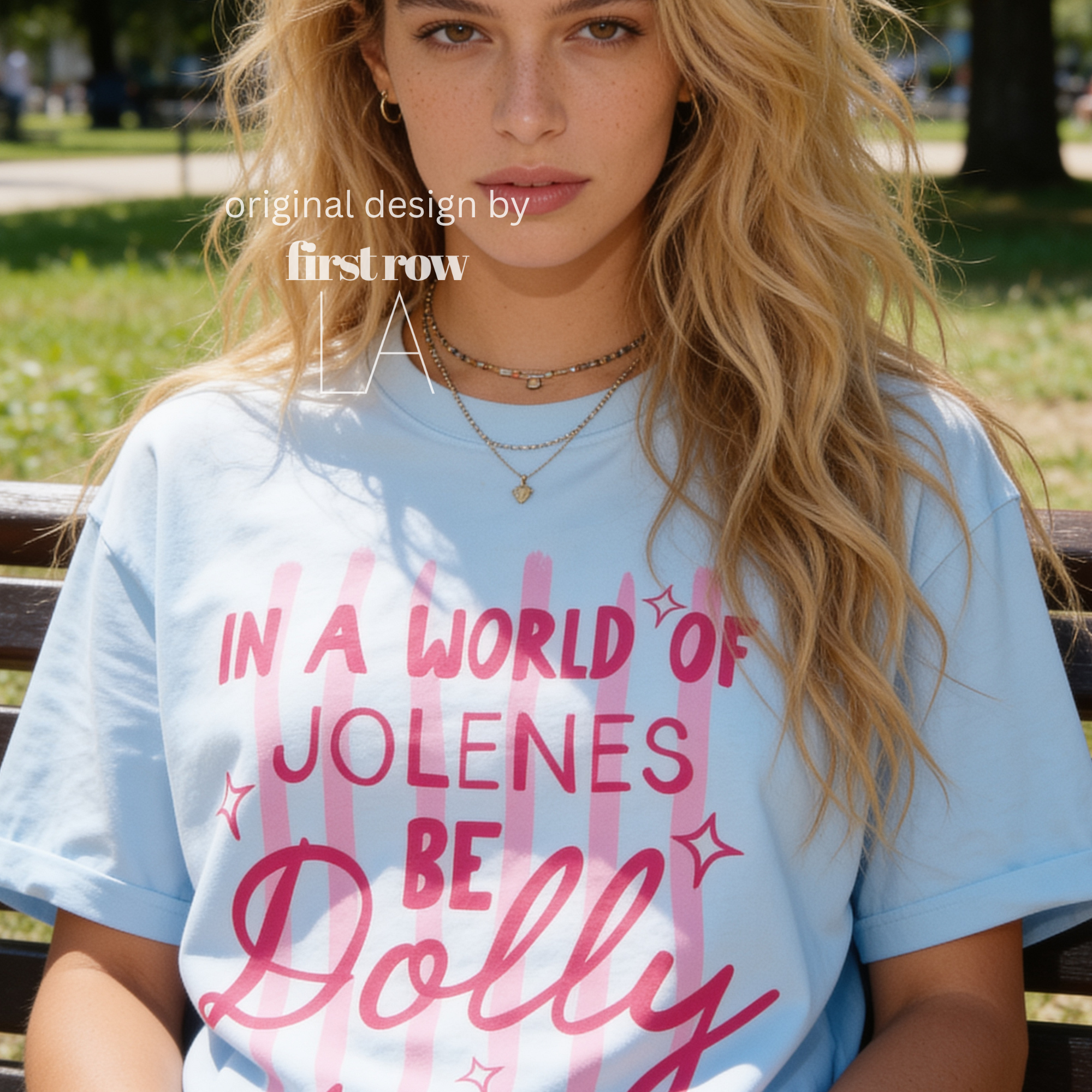 A woman wearing In a World of Jolenes Be Dolly T-shirt.

Original design and copyright by first row LA August 28th, 2026.