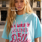 A woman wearing In a World of Jolenes Be Dolly T-shirt.

Original design and copyright by first row LA August 28th, 2026.