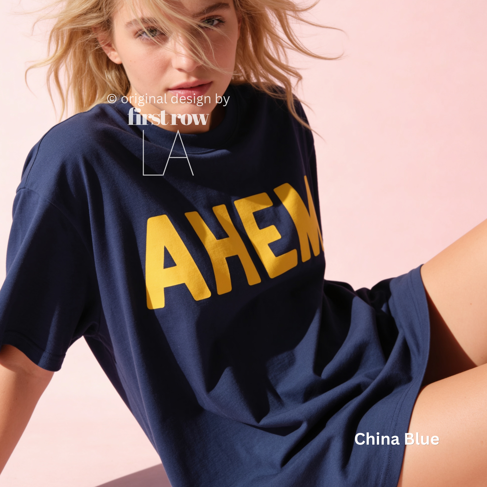 A woman wearing an oversized navy blue T-shirt with large yellow 'AHEM' lettering across the front.

Original design and copyright by first row LA, August 4th 2026.