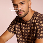 A man wearing a brown short-sleeve t-shirt with a repeating beige lip print.

Original design and copyright by first row LA.