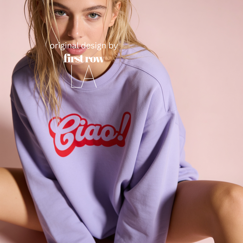 A woman wearing a lavender crewneck sweatshirt with a red 'Ciao!' graphic on the front.

Original design and copyright by first row LA.