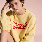 A woman wearing a crewneck sweatshirt with a red 'Ciao!' graphic on the front.

Original design and copyright by first row LA.