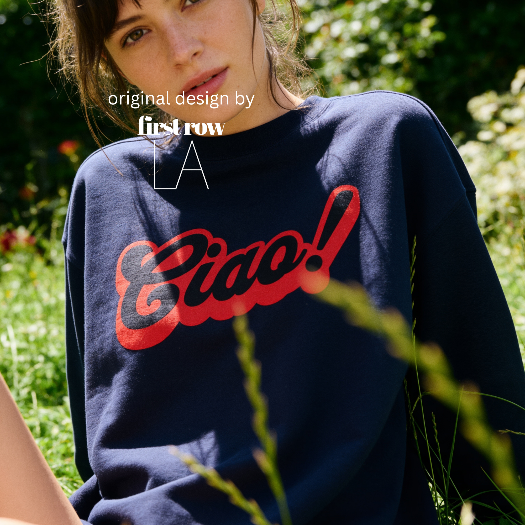 A woman wearing a crewneck sweatshirt with a red 'Ciao!' graphic on the front.

Original design and copyright by first row LA.
