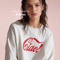 A woman wearing a light gray sweatshirt with a red 'Ciao!' graphic on the front.

Original design and copyright by first row LA.