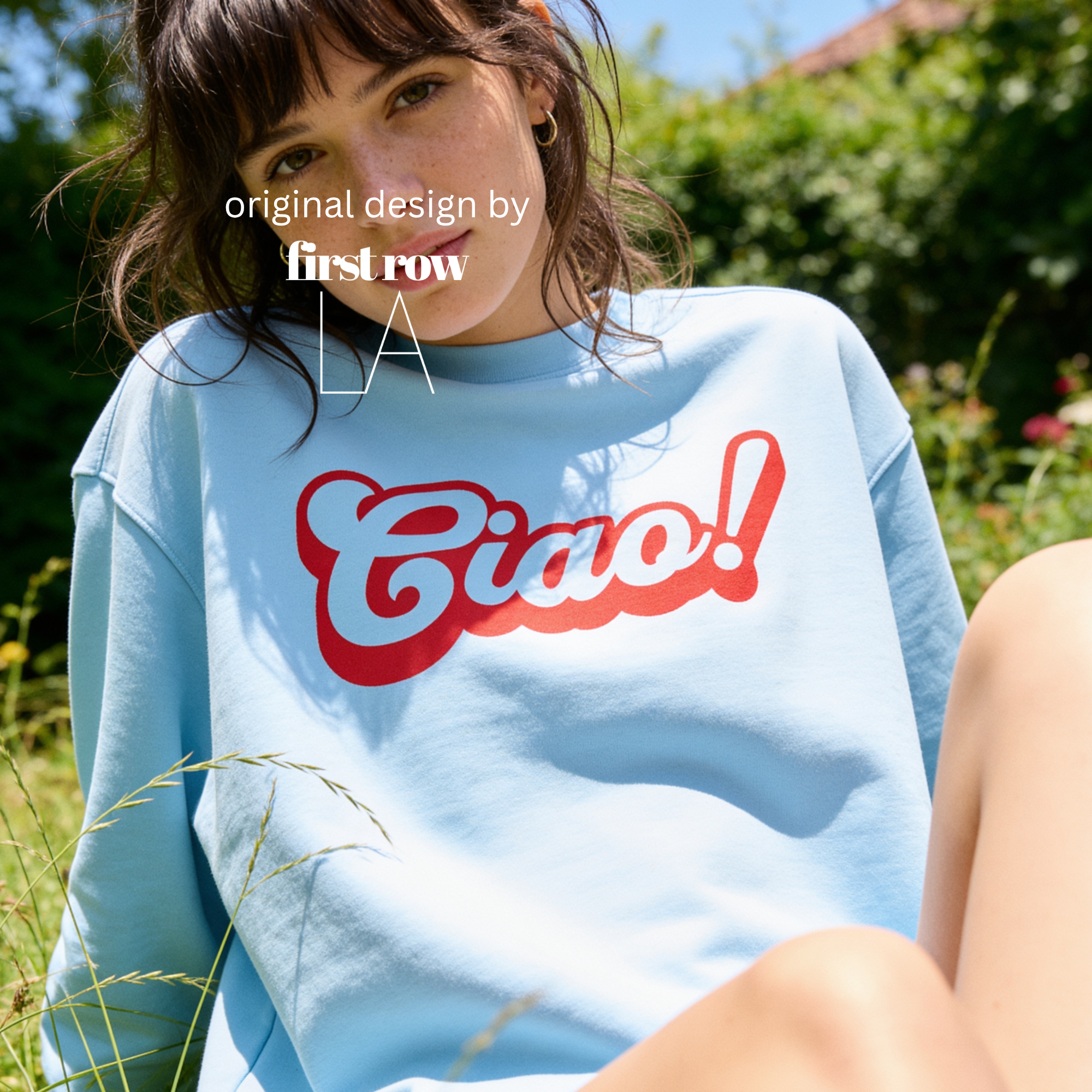 A woman wearing a crewneck sweatshirt with a red 'Ciao!' graphic on the front.

Original design and copyright by first row LA.