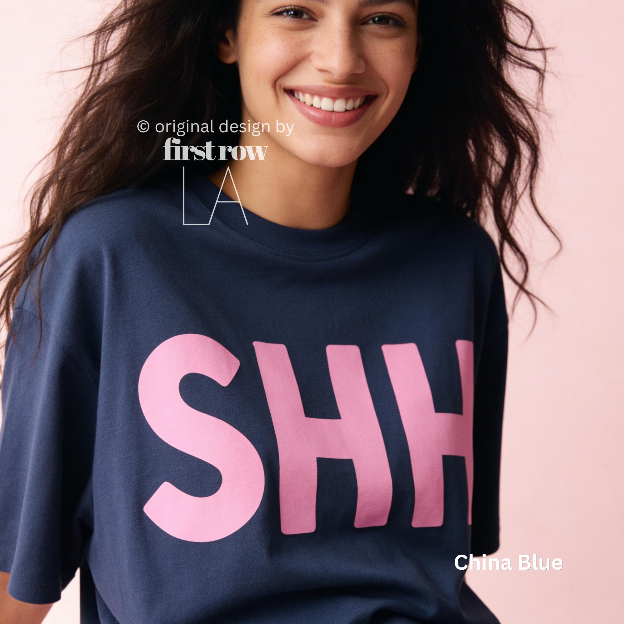 A woman wearing a navy blue T-shirt with large pink block letters spelling 'SHH' across the front.

Original design and copyright by first row LA, August 4th 2026.