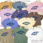 Color options for 'MIDNIGHT SNACK Society' T-shirt in mustard, ice blue, pink, orange, lavender, gray, purple, brown, light blue, cream, white, beige, and light green.

Original design and copyright by first row LA 2026