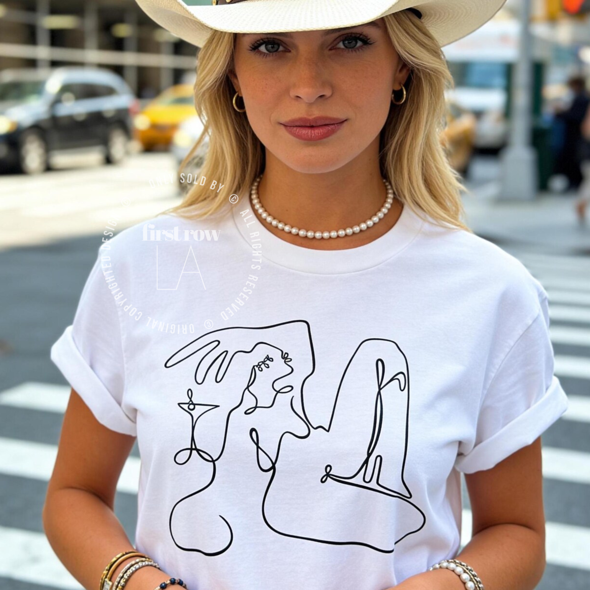Woman wearing Cowgirl Martini Shirt, Cowboy Boots Tee, Western Graphic T-Shirt, Country Concert Outfit, Nashville Bachelorette Tee, Rodeo Cowgirl Gift. 

Designed and © 2025 by Lilo on Paper, only sold at First Row LA.