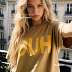 A woman wearing a mustard yellow oversized t-shirt with the word 'DUH' printed in bold yellow letters across the front. 

Original design and copyright by first row LA, August 4th 2026.