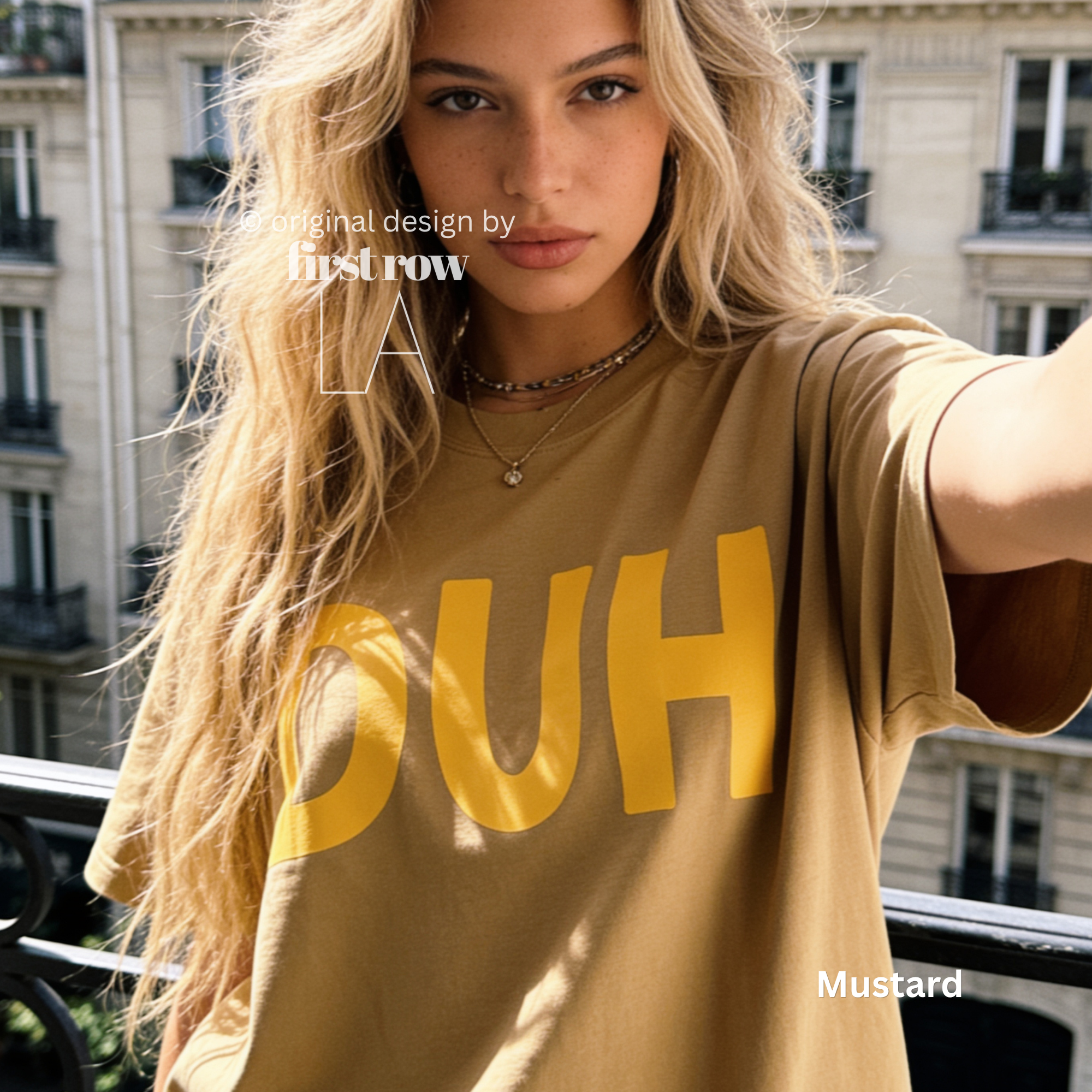 A woman wearing a mustard yellow oversized t-shirt with the word 'DUH' printed in bold yellow letters across the front. 

Original design and copyright by first row LA, August 4th 2026.