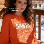 A woman wearing crewneck sweatshirt with the text 'Dear SANTA I can EXPLAIN'.

Original design and copyright by first row LA, August 10th 2026.